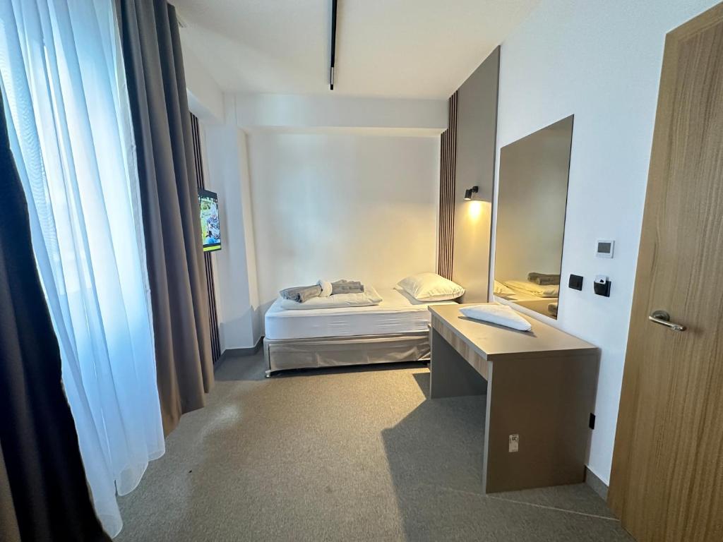 Postel nebo postele na pokoji v ubytování Hotel Suljovic