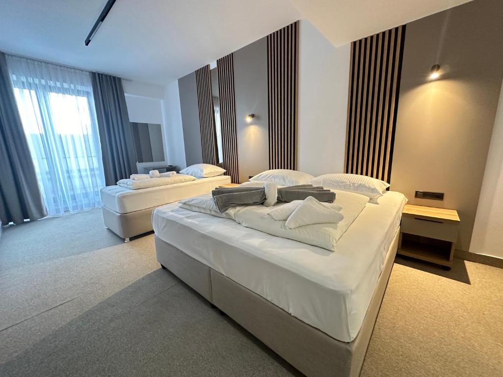 Postelja oz. postelje v sobi nastanitve Hotel Suljovic