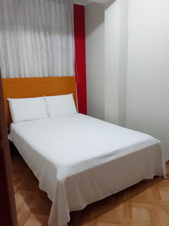 Postel nebo postele na pokoji v ubytování Hostal Terraoro