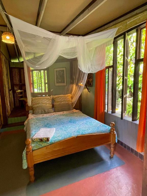 Postel nebo postele na pokoji v ubytování Cocoa Cottage