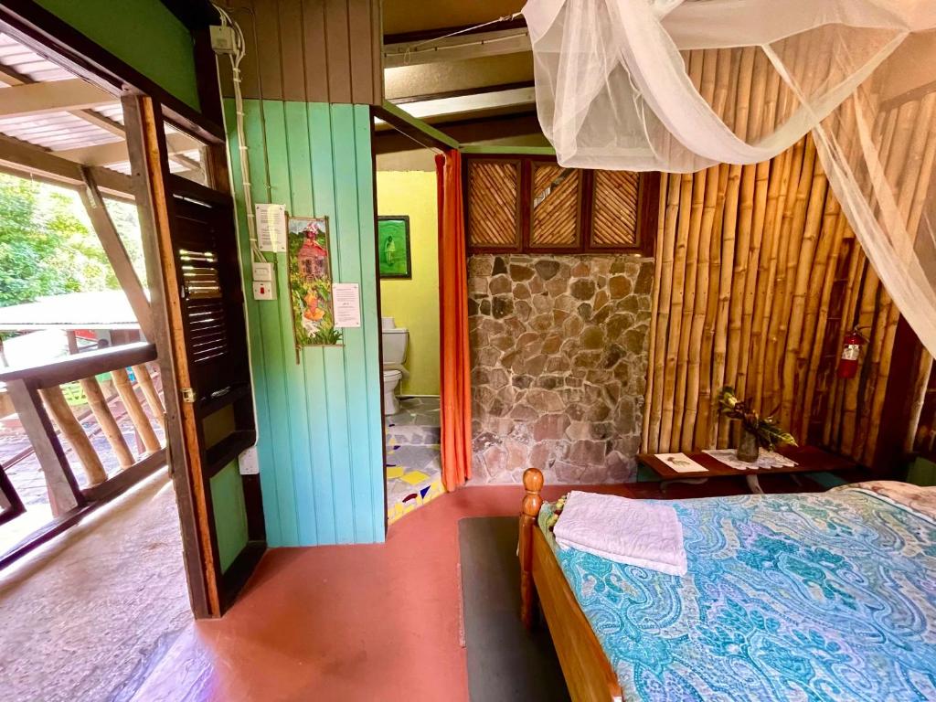Postel nebo postele na pokoji v ubytování Cocoa Cottage