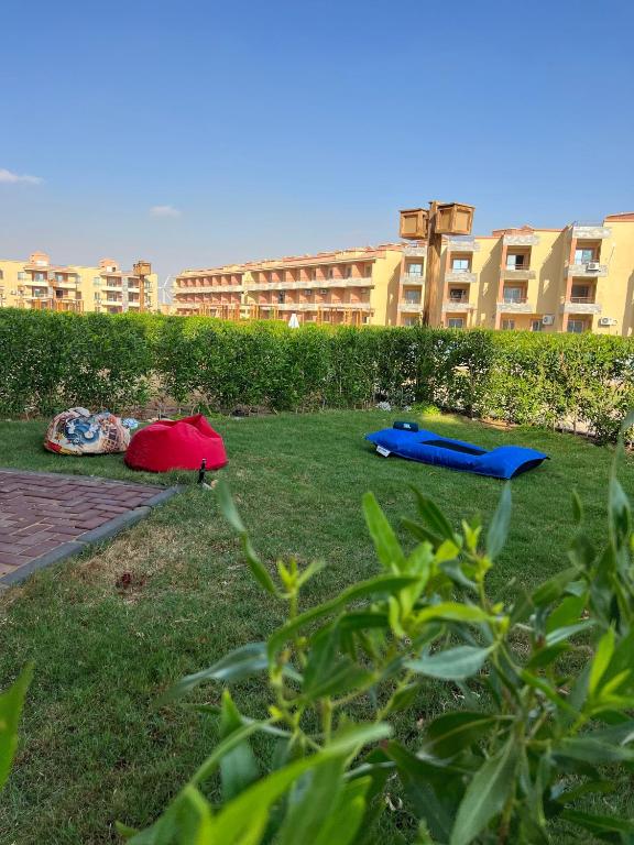 two tents laying on the grass in a park at Chalet in La Jolie Marina El Ain El Sokhna - Egyptian Families Only in Ain Sokhna