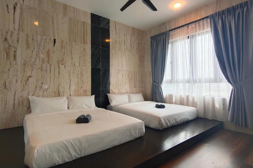 Postel nebo postele na pokoji v ubytování Sunway Onsen Suites - Theme Park Tambun Ipoh by Ryokan Management