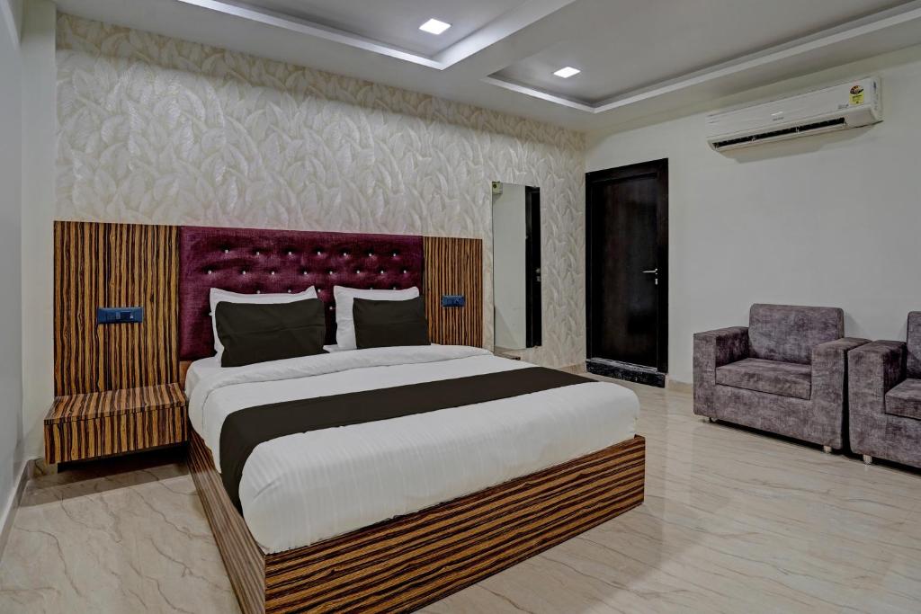 מיטה או מיטות בחדר ב-OYO 82334 Hotel Keshri Inn