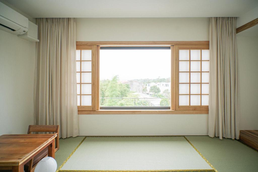 Postel nebo postele na pokoji v ubytování Hajime Homestay Hue