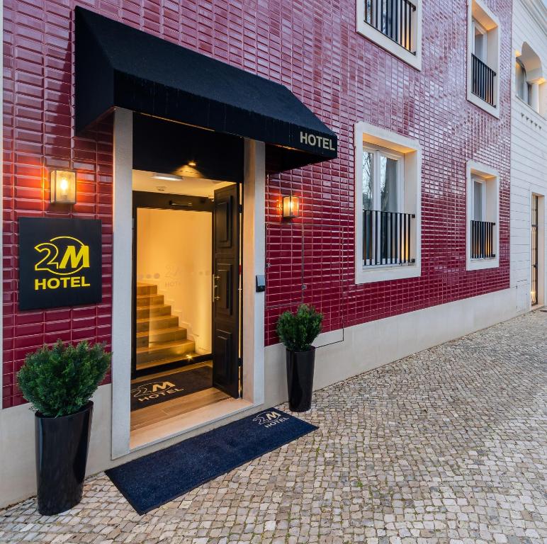 a store front of a red brick building at 2M BOUTIQUE HOTEL in Montijo