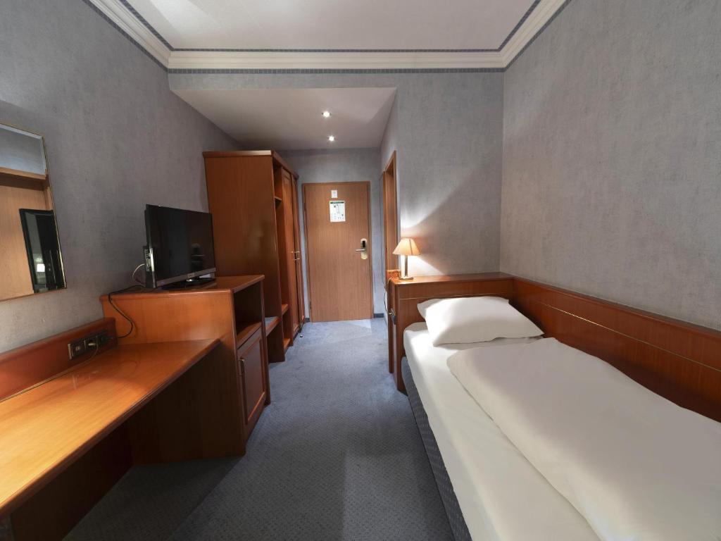 Voodi või voodid majutusasutuse B&B HOTEL Gotha-Hbf toas
