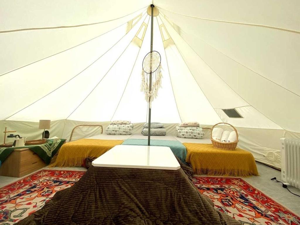 a room with a bed in a tent at Unno Glamping - Vacation STAY 27780v in Nantan city