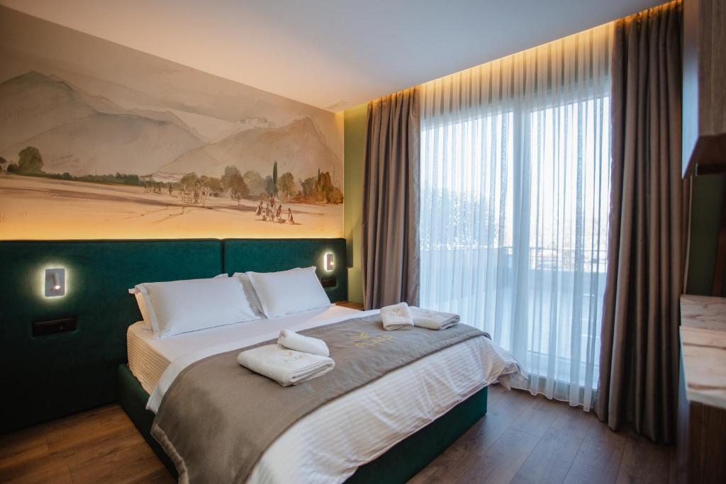 Postel nebo postele na pokoji v ubytování Hotel Flaer