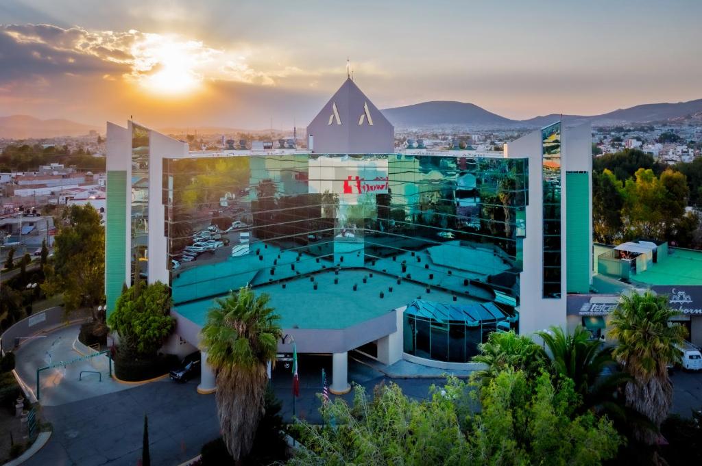 an aerial view of a large building with a pool at La Joya Pachuca in Pachuca de Soto