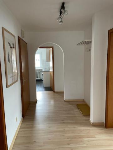 an empty room with a hallway with at Dell Ferienwohnung in Offenburg