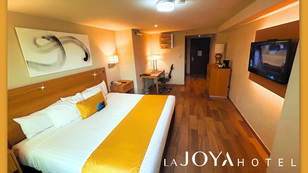 Postel nebo postele na pokoji v ubytování La Joya Pachuca