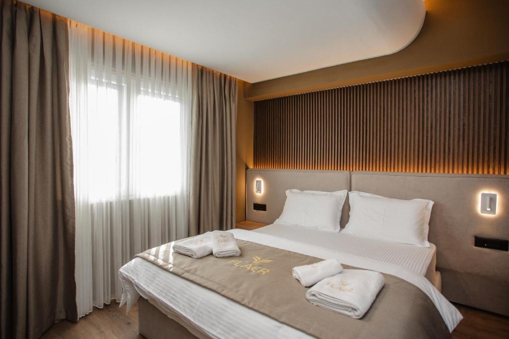 Postel nebo postele na pokoji v ubytování Hotel Flaer