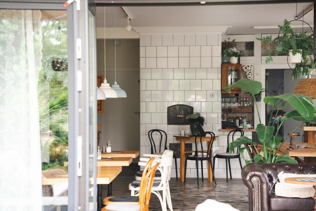 a dining room with chairs and a table at Busola House in Stegna