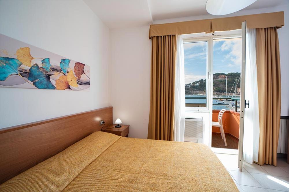 Postel nebo postele na pokoji v ubytování Hotel Belmare