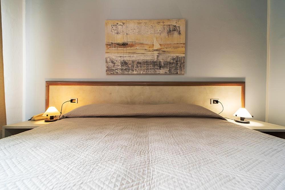 Postel nebo postele na pokoji v ubytování Hotel Belmare