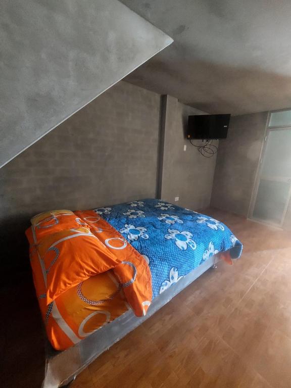 Tempat tidur dalam kamar di Casa de huéspedes