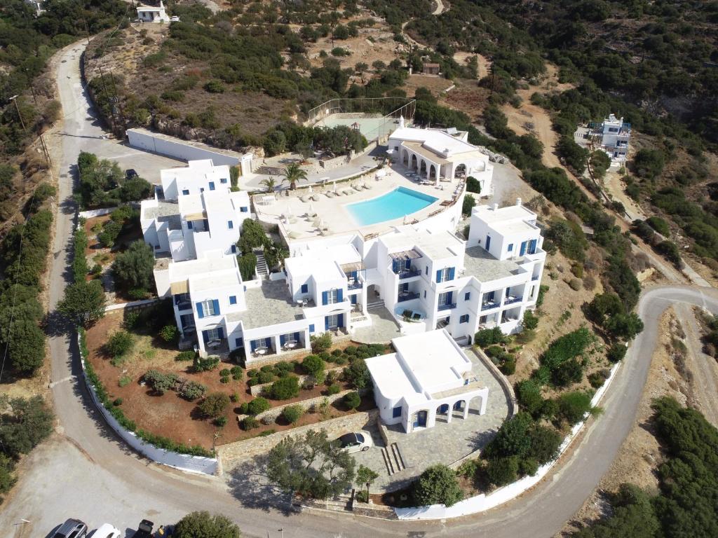 an aerial view of a large white house at El Sol Hotel in Kapsali