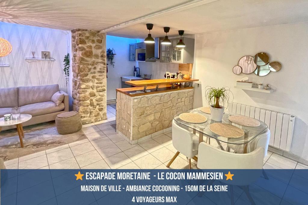 a kitchen and a living room with a table and chairs at Cocon chaleureux entièrement renové à 150m de le Seine in Saint-Mammès