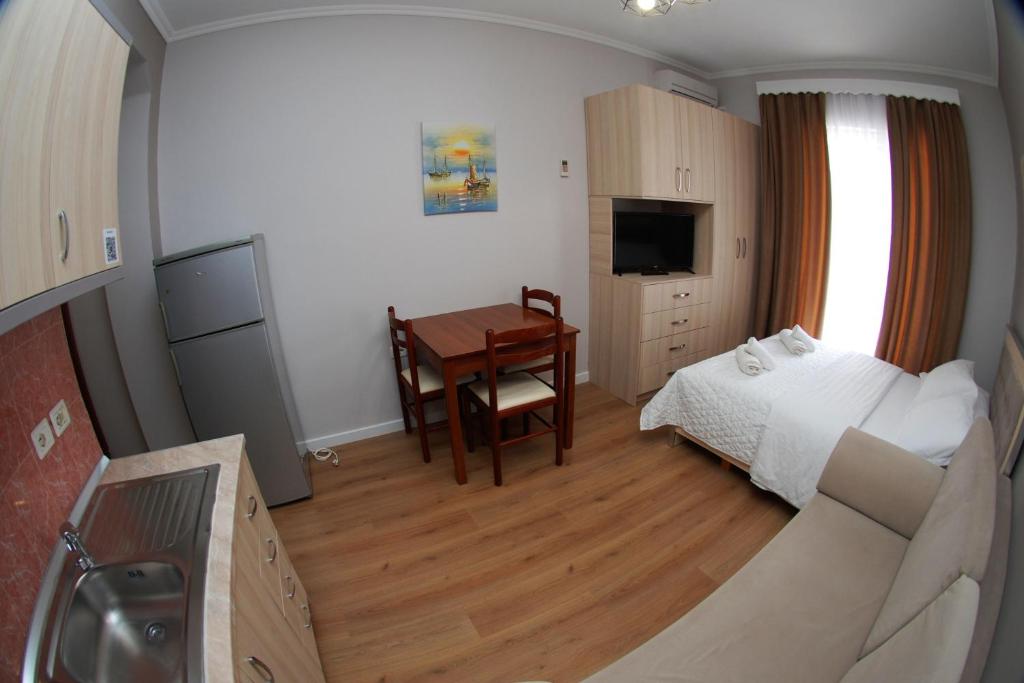 TV i/ili multimedijalni sistem u objektu Hotel Vila Alvin & Apartments