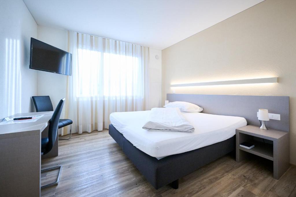 Postel nebo postele na pokoji v ubytování Hotel am Kreisel Self-Check-In by Smart Hotels