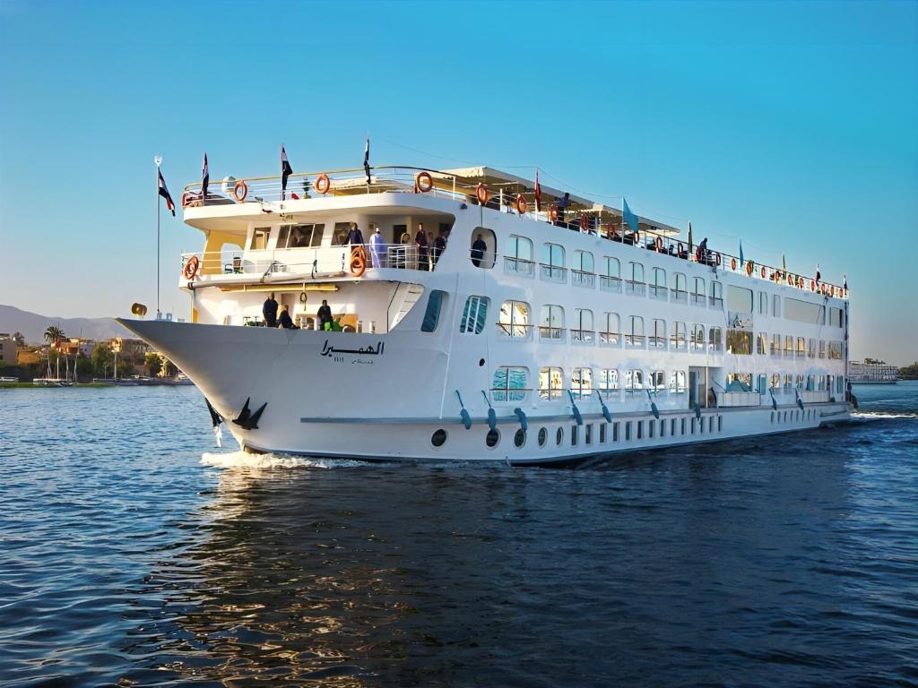 a large cruise ship in the water at Nile cruise, Luxor, Aswan, Floating hotel Alhambra A F in Aḑ Ḑab‘īyah