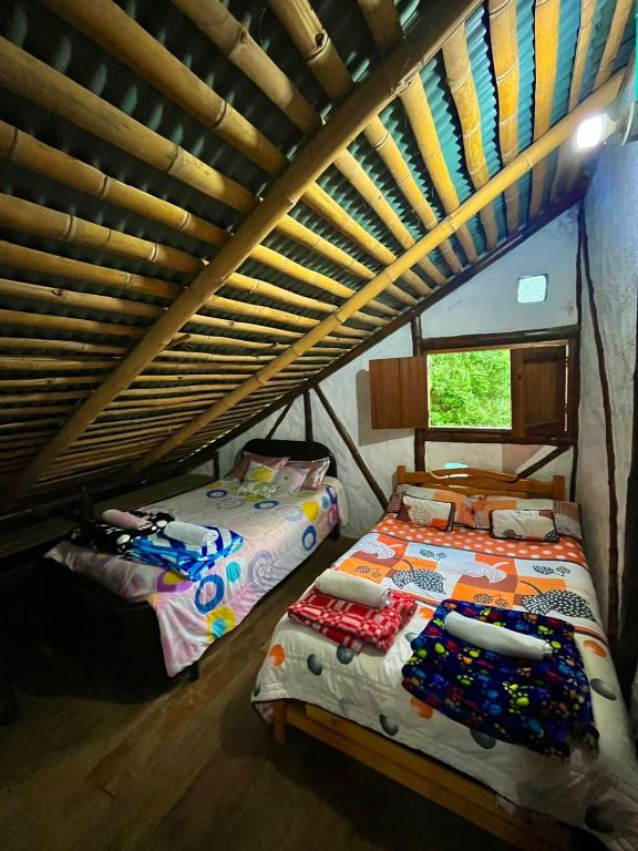 Postel nebo postele na pokoji v ubytování Casa Annunakis