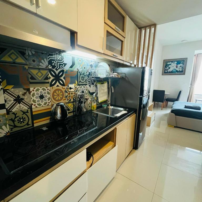 Kuchyň nebo kuchyňský kout v ubytování Awesome Rivergate Apartment - CBD in Hcm City