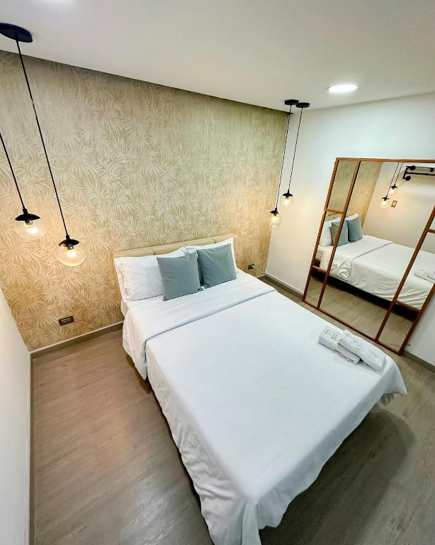 Postel nebo postele na pokoji v ubytování Orbe Hotel Medellín