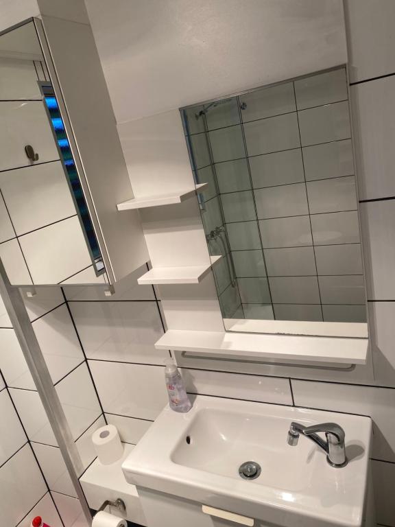 a bathroom with a sink and a mirror at Guesthouse in pacific paradise in Pacific Paradise 