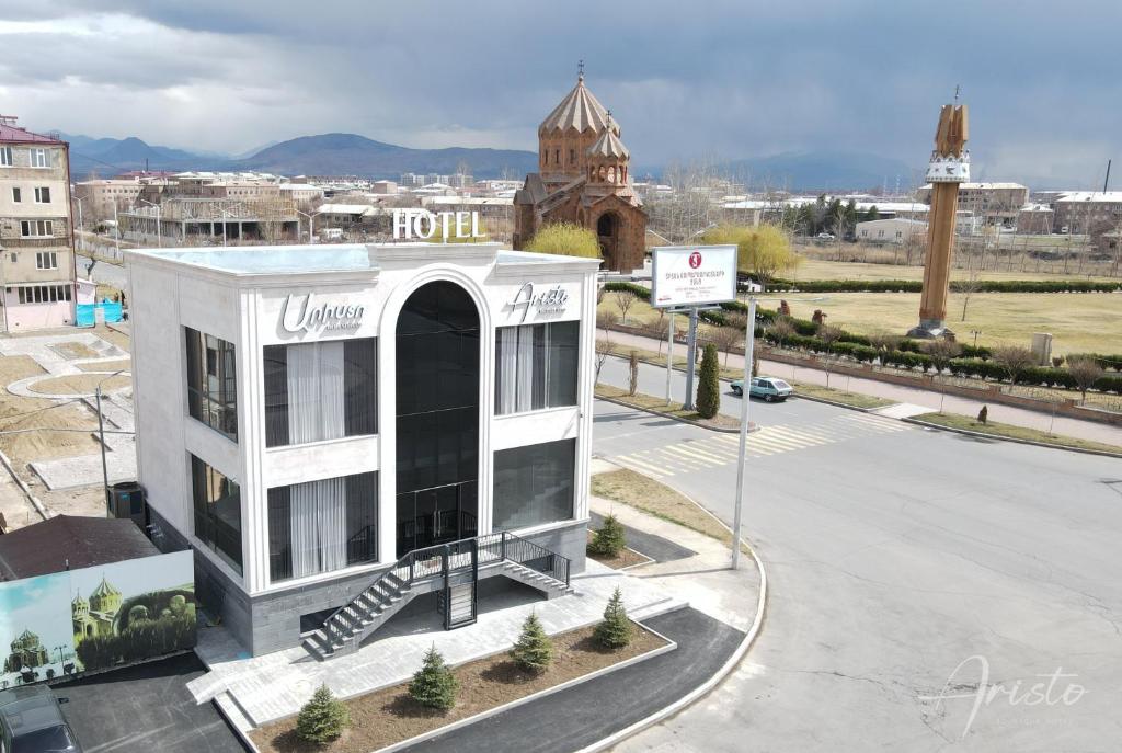 a building in the middle of a street at Aristo Boutique Hotel in Artashat
