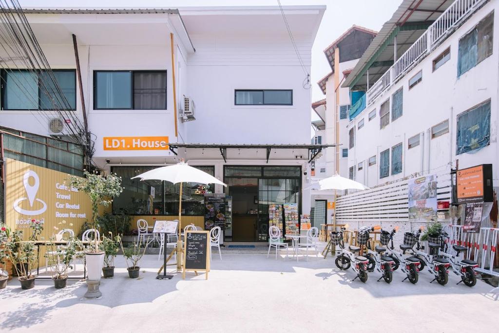 a group of motorcycles parked in front of a building at LD1.House Private Room,Thapae Gate, Chiang Mai Old city in Chiang Mai