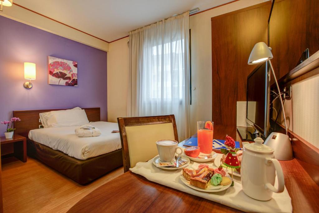 Postel nebo postele na pokoji v ubytování Hotel Europa