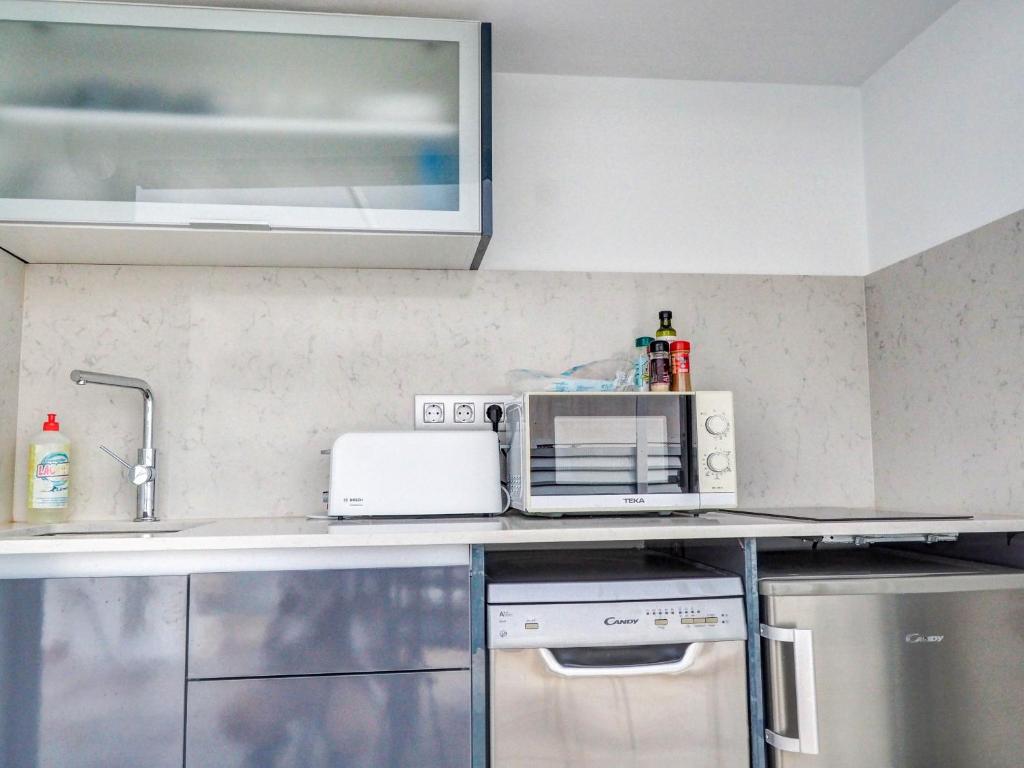 Kuchyňa alebo kuchynka v ubytovaní Blue Serenity by Hello Homes Sitges