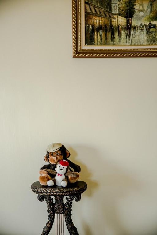 a small table with two stuffed animals on it at Alps Garden B&amp;B in Wujie