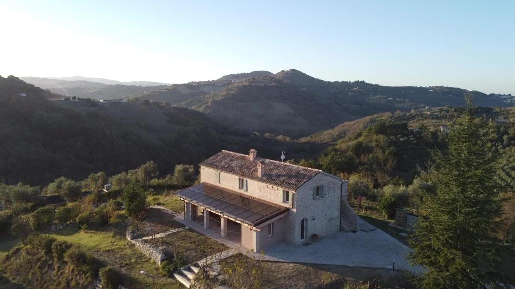 an aerial view of a house in the mountains at B&B Villa Arcadia in Saludecio