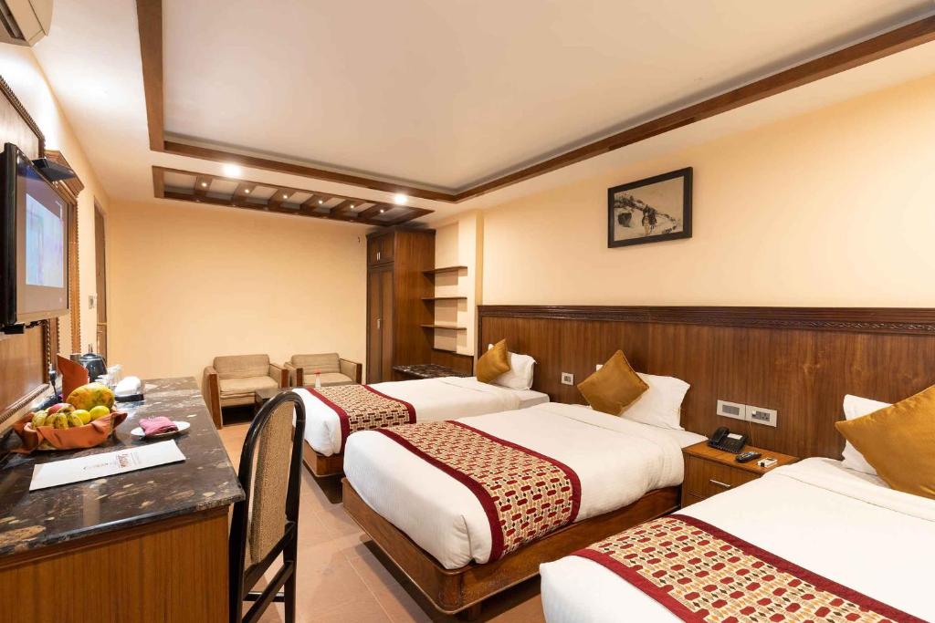 Postel nebo postele na pokoji v ubytování Hotel Manang
