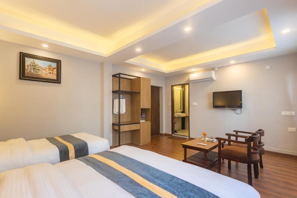 Postel nebo postele na pokoji v ubytování Aawas Boutique Hotel