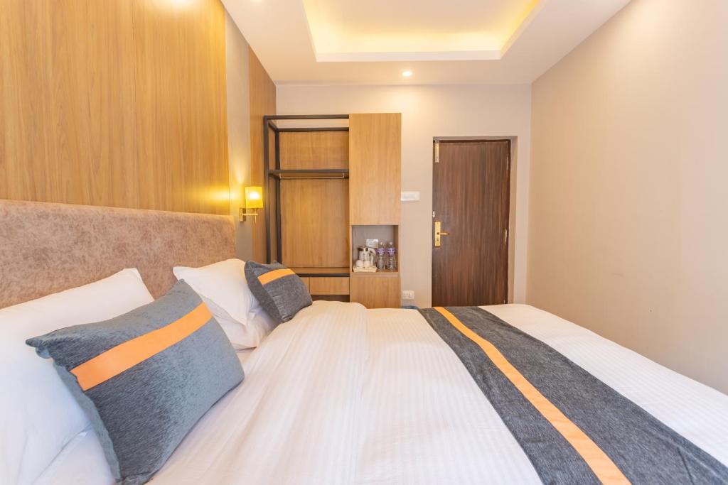 Postel nebo postele na pokoji v ubytování Aawas Boutique Hotel