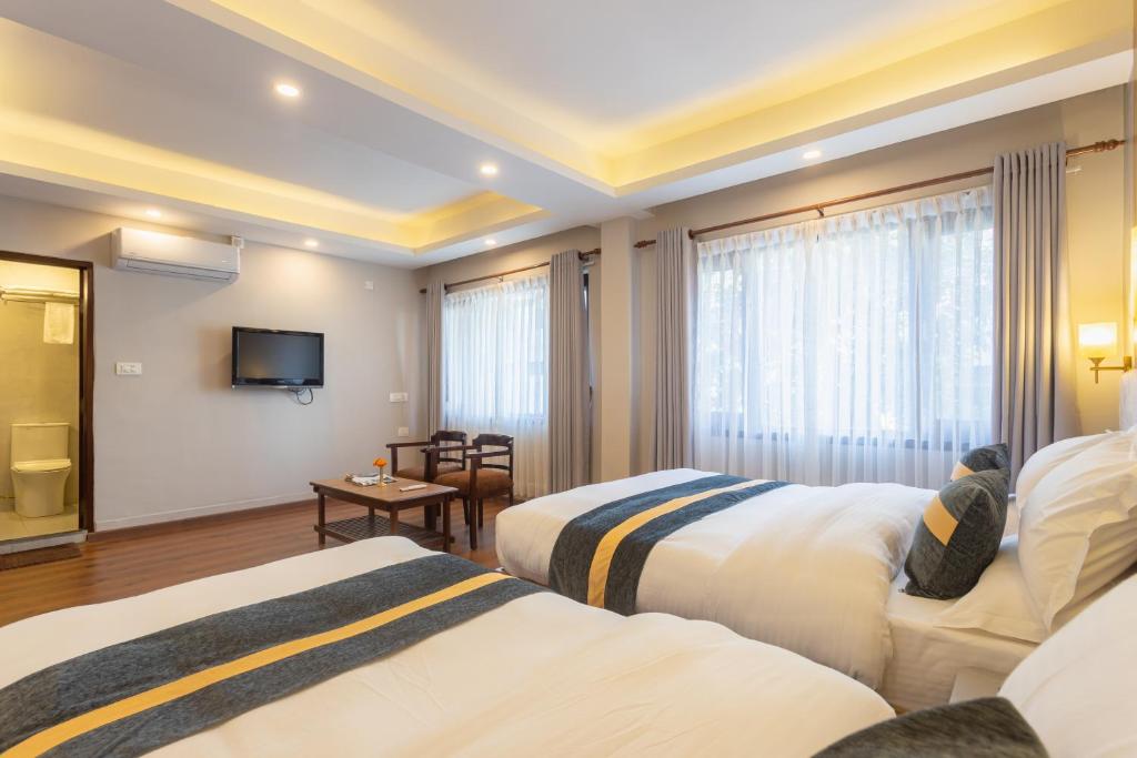 Postel nebo postele na pokoji v ubytování Aawas Boutique Hotel