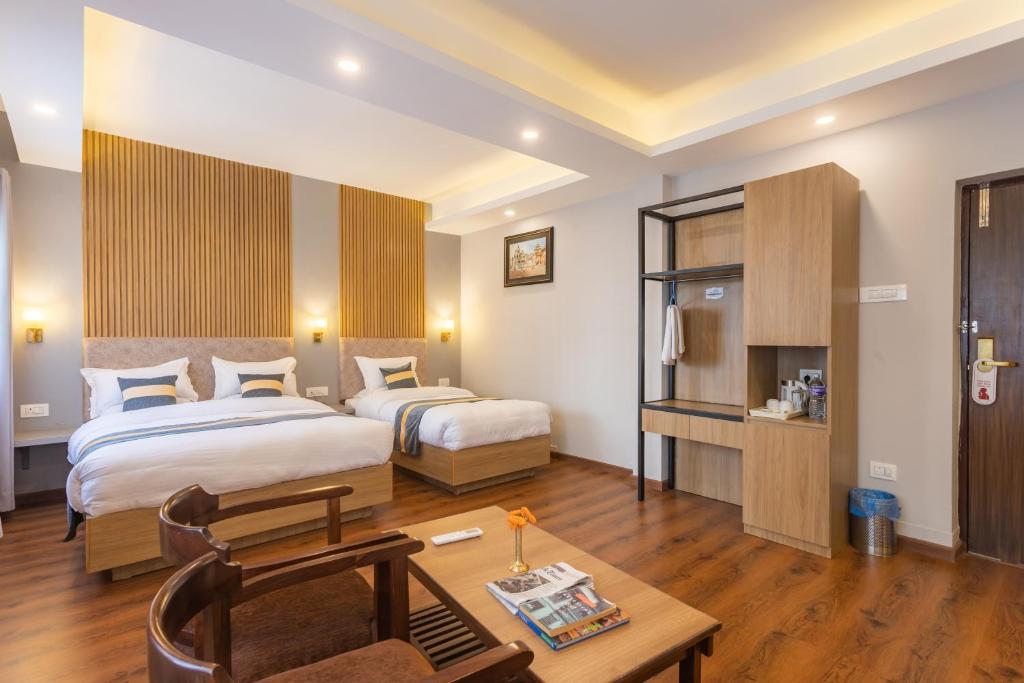 Postel nebo postele na pokoji v ubytování Aawas Boutique Hotel