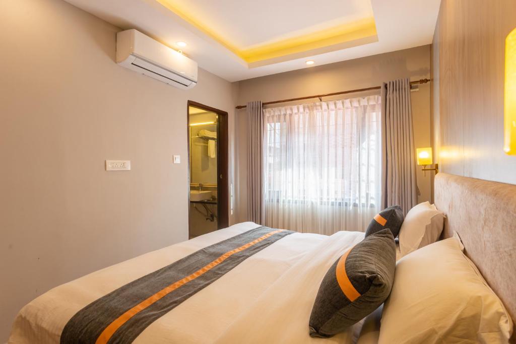 Postel nebo postele na pokoji v ubytování Aawas Boutique Hotel