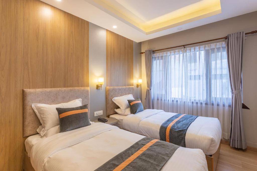 Postel nebo postele na pokoji v ubytování Aawas Boutique Hotel