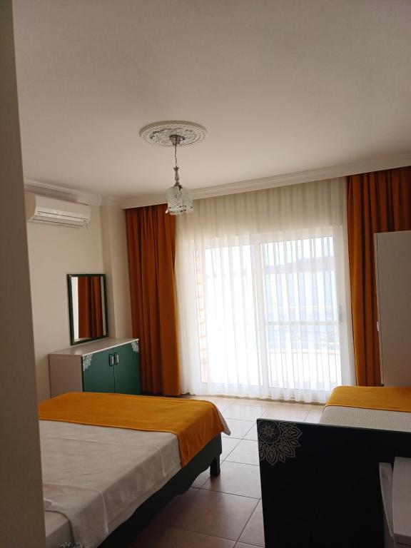 Postel nebo postele na pokoji v ubytování Yazıcı Otel Bozburun