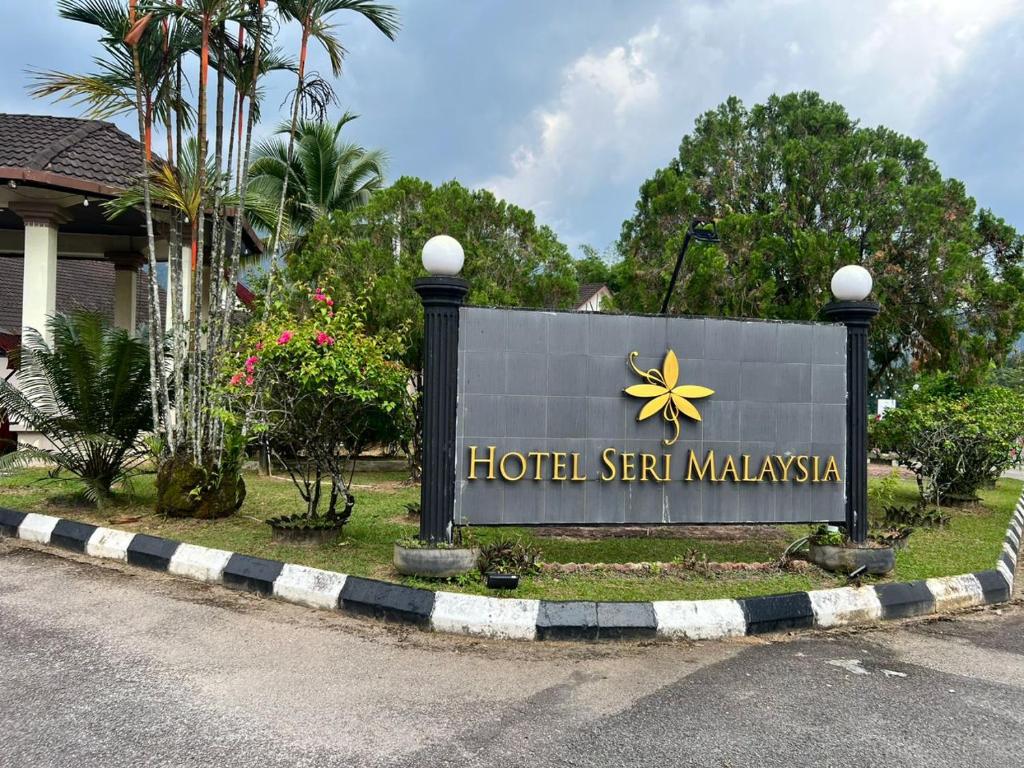 a sign for a hotel sign malaysia on the side of a road at Hotel Seri Malaysia Taiping in Taiping