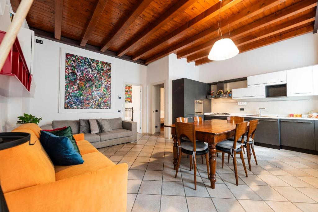 a living room with a couch and a table at mirko apartment in Verona