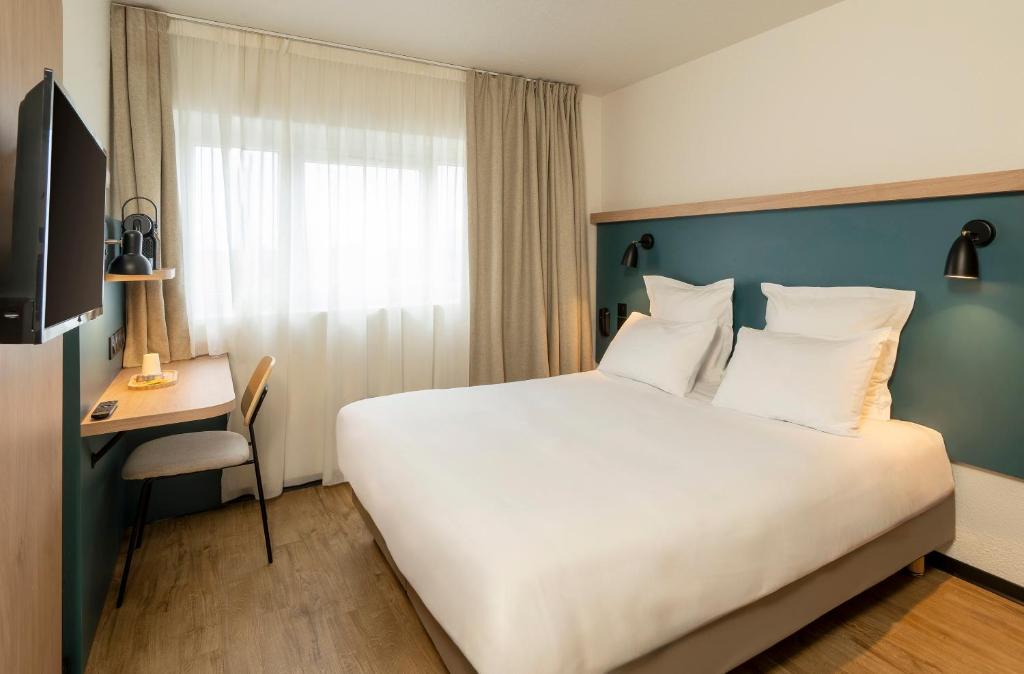 Postel nebo postele na pokoji v ubytování Le Carline, Sure Hotel Collection by Best Western