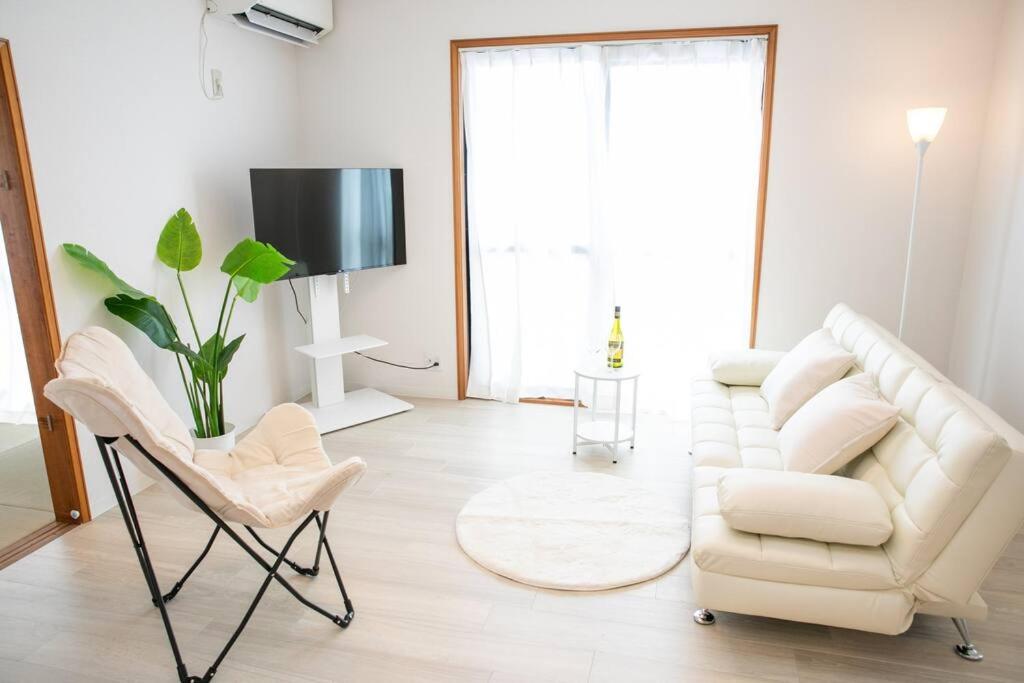 TV a/nebo společenská místnost v ubytování Nagashima Riverside House 4