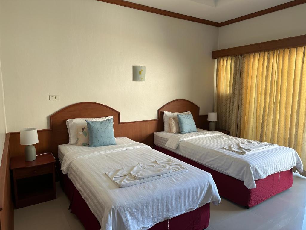 Postel nebo postele na pokoji v ubytování Sabai Sabai hotel