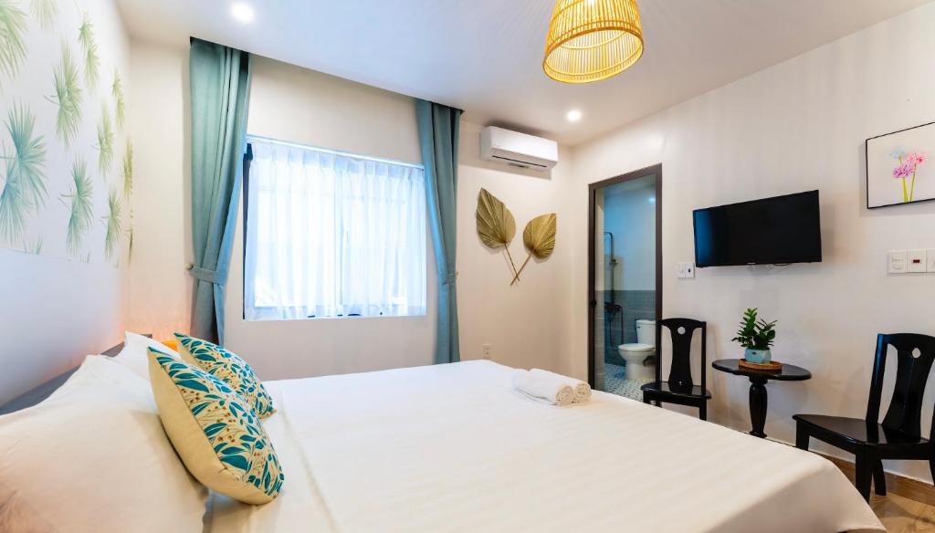 Postel nebo postele na pokoji v ubytování Luna Verde Hotel Hoi An